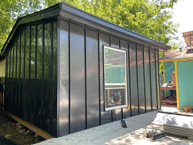 Black standing seam metal wall panels for Roof Inspection in Ankeny